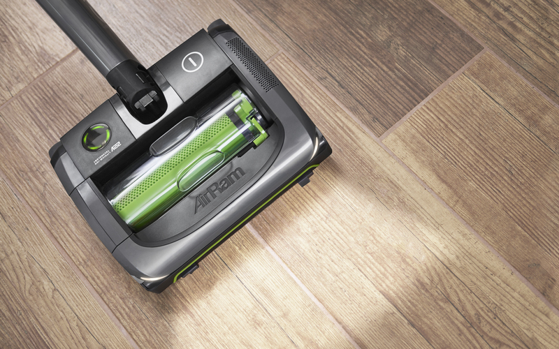 cleaning hardwood floors with an cordless upright vacuum