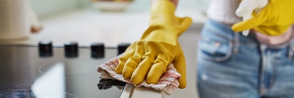 Woman cleaning the kitchen