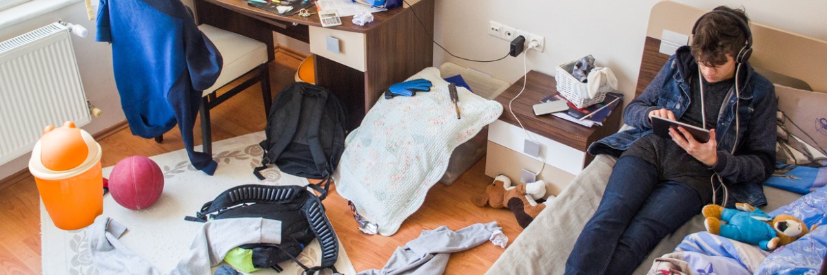 Person sat in messy room