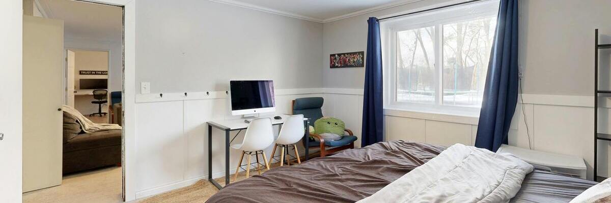Decluttered bedroom with tidy desk in the corner